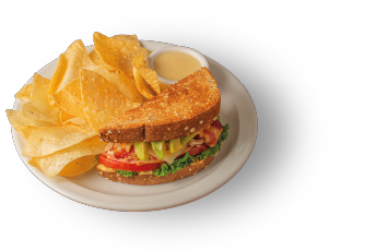 Disfrutá en Denny’s un sándwich lleno de sabor: pechuga de pavo, jamón, tocino, queso Suizo y aguacate fresco en pan de 7 granos tostado, con mayonesa de tomates secos, lechuga y tomate. Un imperdible de la comida saludable en nuestros restaurantes familiares.